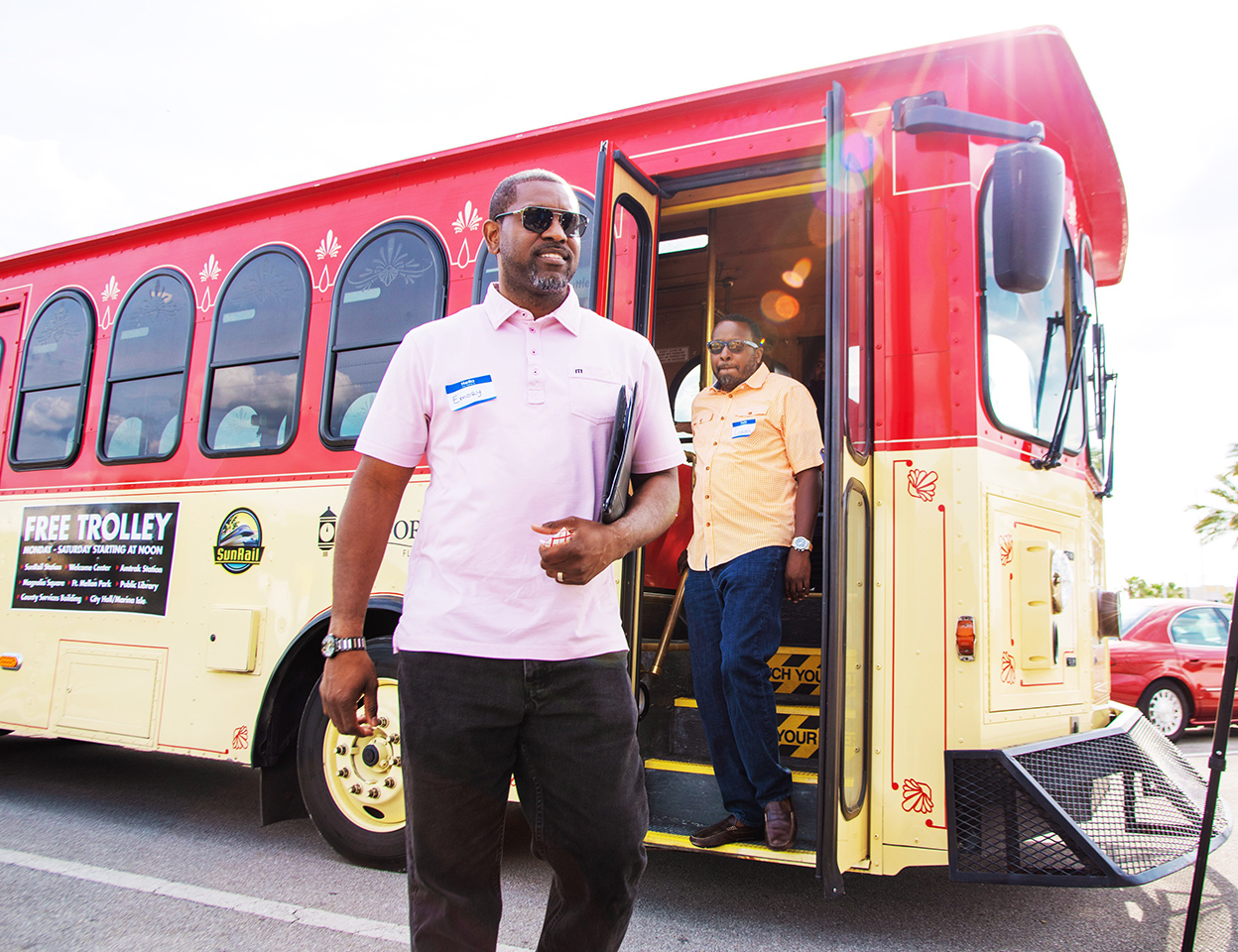 Two men exiting the Sanford Trolley.