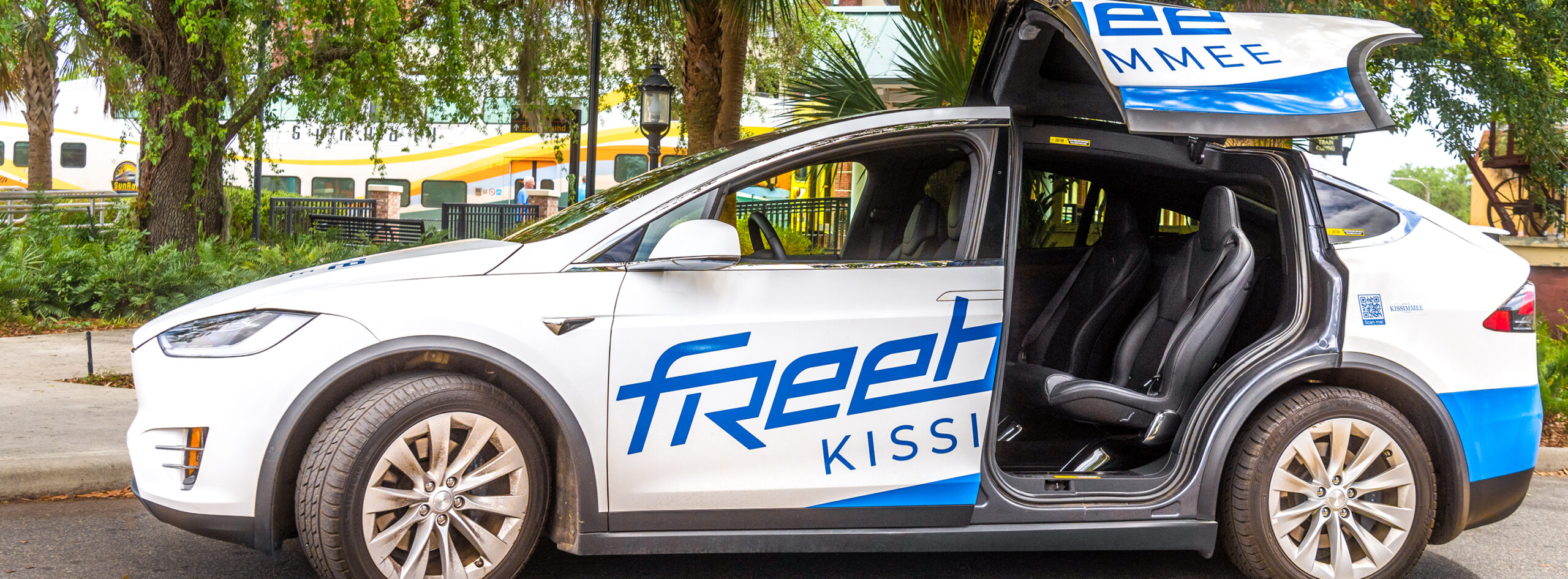 Masthead image - Freebee vehicle parked at Kissimmee/Amtrak station.