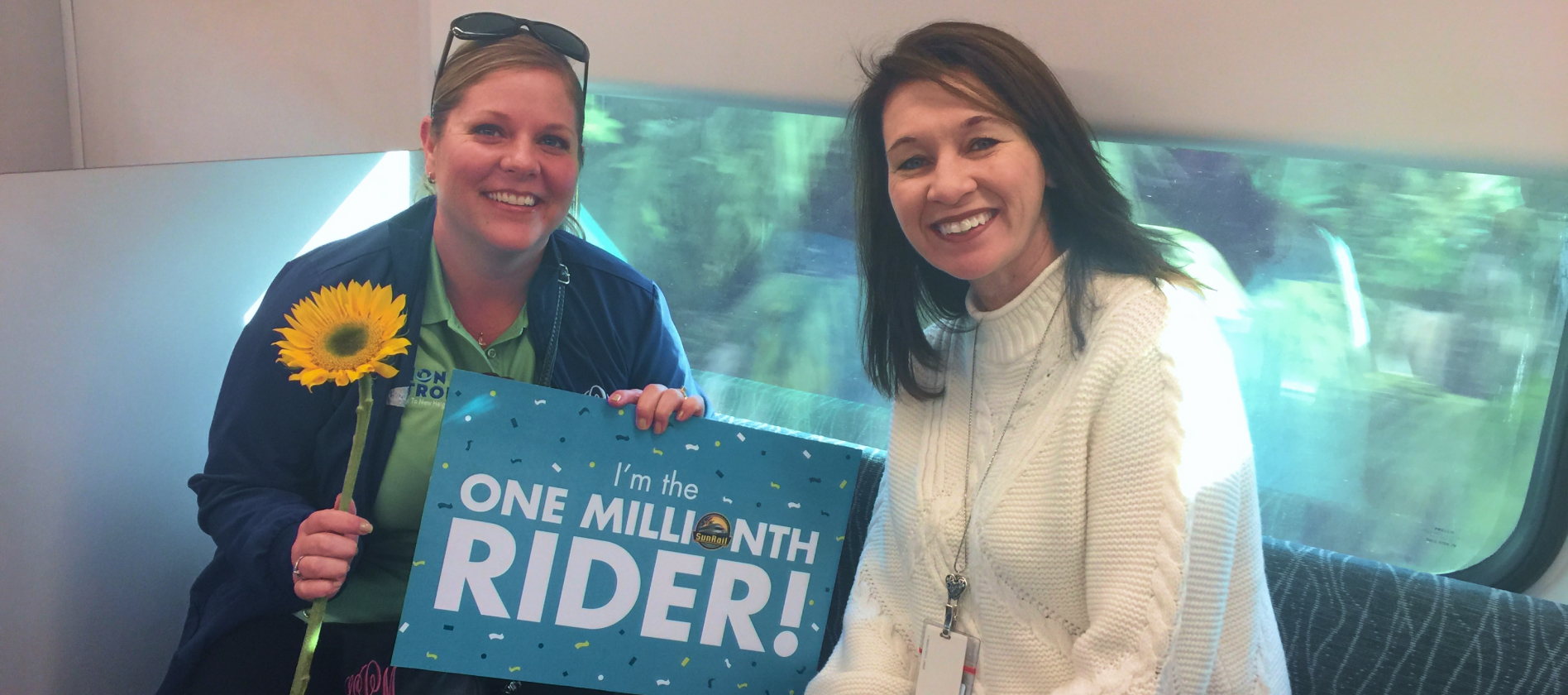 SunRail CEO, Nicola Liquori, celebrates SunRail's one millionth rider, Kim.