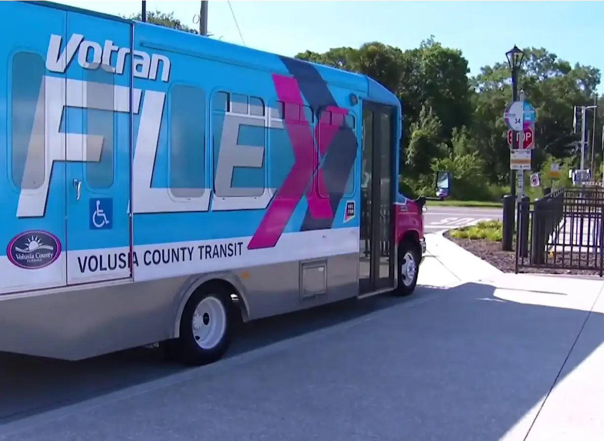 Kia Center - Night Shot Image of Votran Circulator at the DeLand/Amtrak SunRail Station.