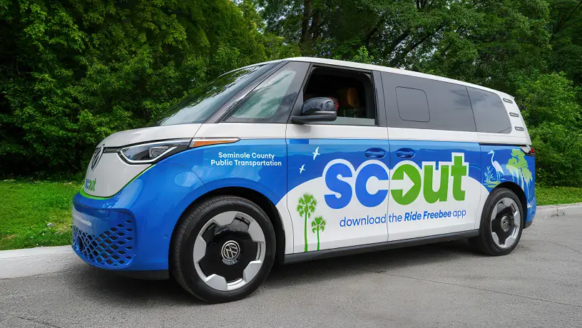 Scout microtransit parked at a curb.