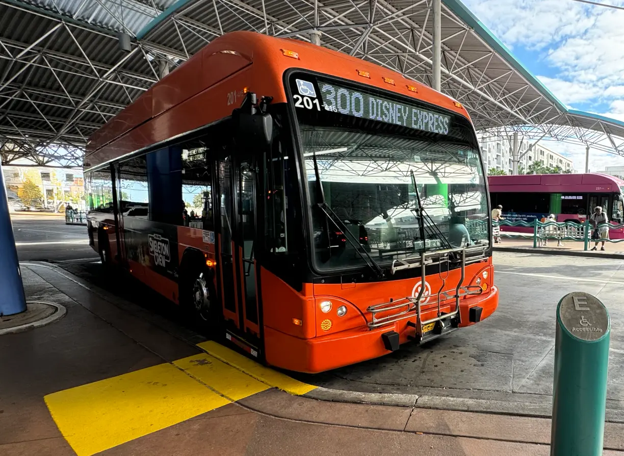 LYNX bus awaits for passengers in front of the ADA pedestrian route at LYNX Central.