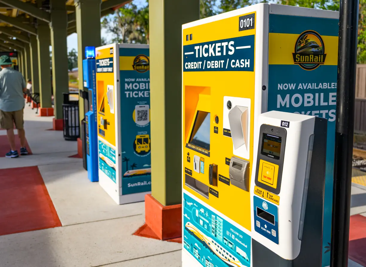 SunRail ticket vending machines and ticket validator on the station platform.