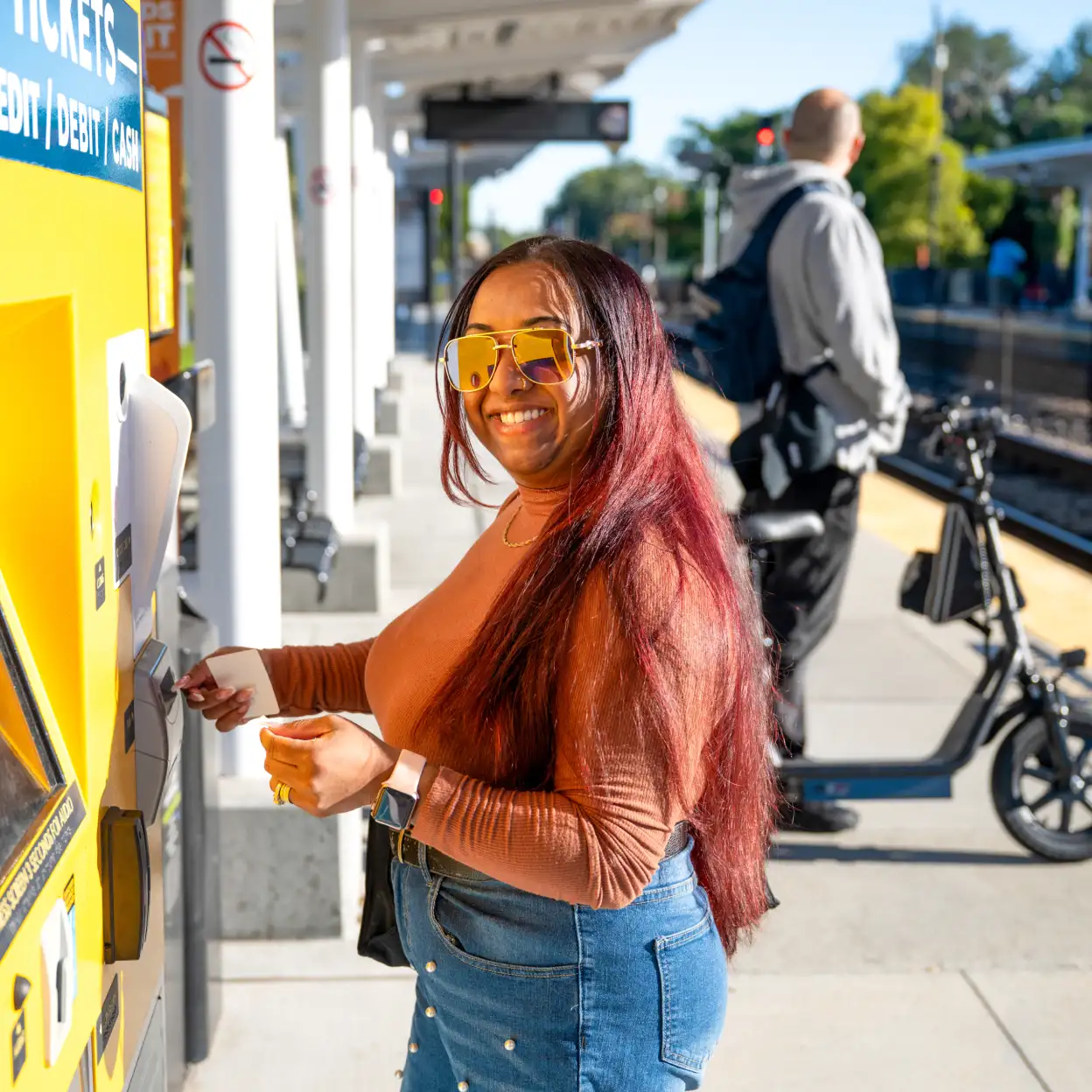 Woman purchasing SunRail fare.