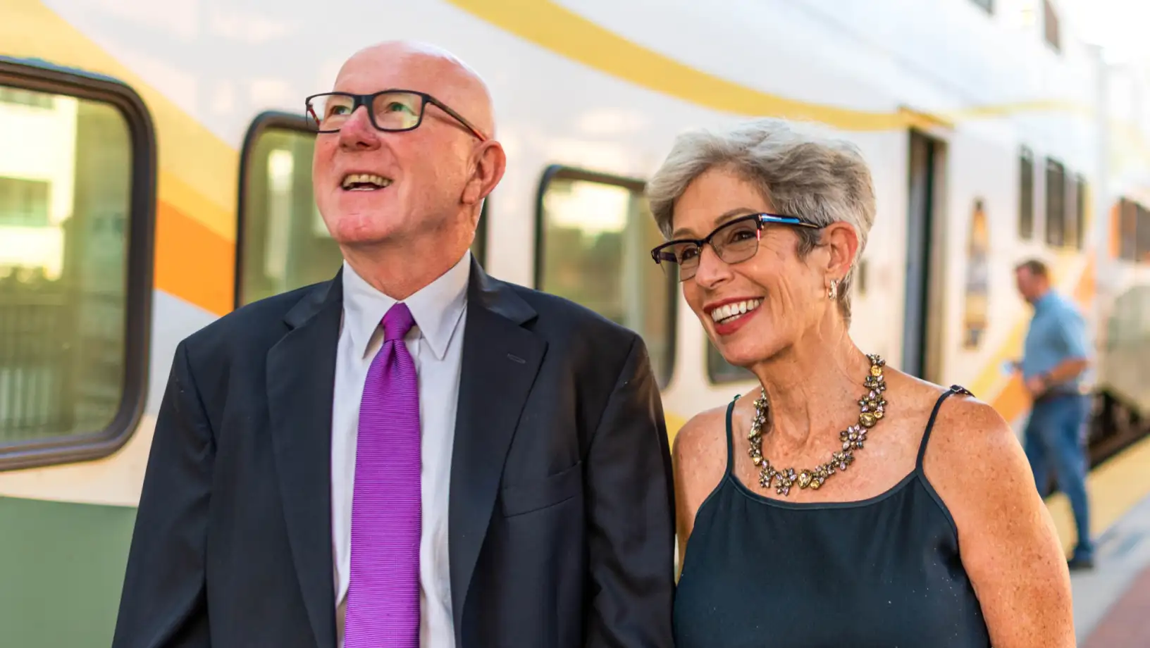 Couple dressed nicely walking on SunRail platform.